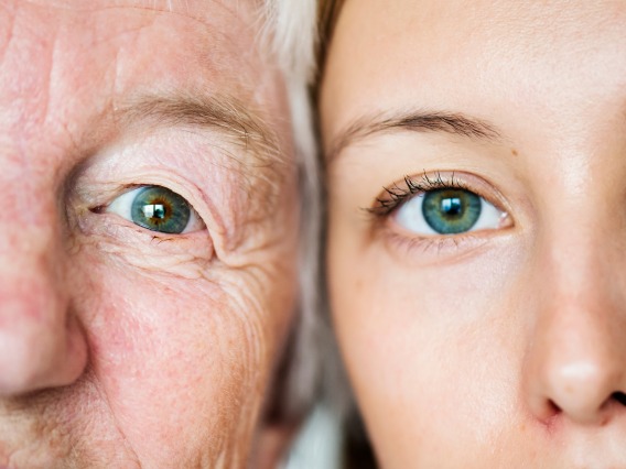 two faces side by side with blue-green eyes